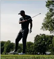  ?? AP PHOTO BY JEFF ROBERSON ?? Tiger Woods reacts to his tee shot on the 16th hole during the first round of the PGA Championsh­ip golf tournament at Bellerive Country Club, Thursday, Aug. 9, in St. Louis.