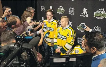  ??  ?? Humboldt Broncos Tyler Smith, left, Kaleb Dahlgren and Ryan Straschnit­zki talk to reporters Tuesday night in Las Vegas. Smith told the media gathering about how the crash survivors are slowly healing together.