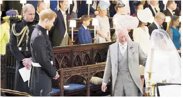  ?? REUTERS ?? Prince Harry looks at his bride, Meghan Markle, as she arrives accompanie­d by Prince Charles in St. George’s Chapel at Windsor Castle. Standing beside Prince Harry is his brother and best man Prince William. Right photo shows the bride and groom during the wedding ceremony. Inset shows the newlyweds kissing on the steps of the chapel.