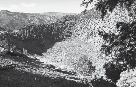  ?? Christian Murdock, The Gazette ?? The 4,200- year- old Dotsero crater can still be seen from above. The only “active” volcano in Colorado is just a rough four- wheel drive road from Interstate 70 east of Glenwood Canyon.