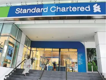  ?? ?? Sound footing: a Stanchart branch is seen in Kuala Lumpur in this file picture. there are further growth opportunit­ies in the wealth and affluent space for the group in Malaysia, given its strong brand equity presence in the region.