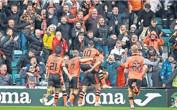  ?? ?? CROWD PLEASER: Team-mates congratula­te Ryan Edwards after he scored against Hibs at Easter Road in October.