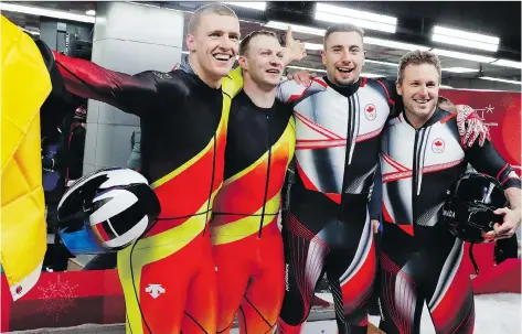  ?? ANDY WONG/THE ASSOCIATED PRESS ?? Germans Thorsten Margis, left, and Francesco Friedrich celebrate while standing next to Canadians Alex Kopacz and Justin Kripps after both teams tied for the gold medal in the two-man bobsled. Over four heats, the two sleds had a time of 3:16.86.