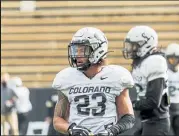  ?? Curtis Snyder / Courtesy photo ?? CU's Isaiah Lewis (23) warms up before the Buffs' scrimmage this past Saturday.