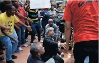  ?? PICTURE: PABALLO THEKISO ?? BETWEEN A ROCK AND A HARD PLACE: Protesting students pin down university prinicipal and vice-chancellor Adam Habiba as he tries to speak to them during last year’s protests.