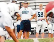  ?? Jerry Baker / For the Chronicle ?? Kingwood coach Barry Campbell watches the action during team practice.