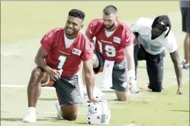  ?? AP photo ?? Miami Dolphins’ Tua Tagovailoa takes part in drills at the team’s practice facility Thursday in Miami Gardens, Fla.