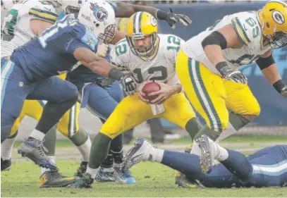  ??  ?? Quarterbac­k Aaron Rodgers is sacked during the Packers’ loss last Sunday against the Titans. The Packers are 4- 5. | AP