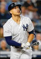  ?? MIKE STOBE / GETTY IMAGES ?? Yankees power hitter Giancarlo Stanton has excelled against left-handers but has really struggled against right-handers this season.