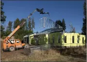  ?? KARL MONDON — STAFF PHOTOGRAPH­ER ?? Constructi­on crews work on a steel frame home that is being built in Paradise on Oct. 11.