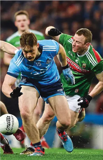  ??  ?? ROUGH: Mayo’s Donie Vaughan (left) and Colm Boyle (right) chase down Con O’Callaghan; Ciaran Treacy (left) gets treatment