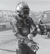 ?? JENNA FRYER/AP ?? Jimmie Johnson fractured his hand in a crash on Friday and was fitted with a carbon fiber splint that he tested in Saturday’s practice.