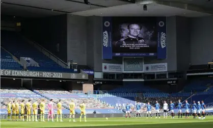  ??  ?? Rangers and Hibernian players participat­e in two minutes’ silence at Ibrox to honour Prince Philip. Photograph: Russell Cheyne/Reuters