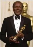  ?? ?? Poitier with the honorary Oscar he was awarded in 2002. Above, he received the Presidenti­al Medal of Freedom from President Obama in 2009.