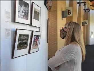  ?? The Sentinel-Record/Grace Brown ?? EXHIBIT CLOSING: Laura Griffis, of Texas, views “Picturing America’s Pastime” at the Hot Springs Convention Center on Tuesday. Saturday is the final day to view the exhibit.