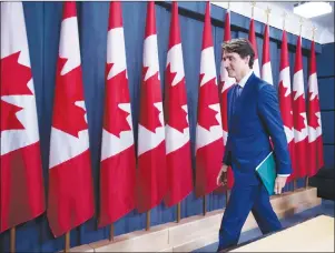  ?? CP PHOTO ?? Prime Minister Justin Trudeau leaves a press conference on his meeting with Alberta Premier Rachel Notley and B.C. Premier John Horgan on the deadlock over Kinder Morgan’s Trans Mountain pipeline expansion, in Ottawa on Sunday.