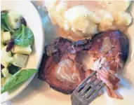  ?? JENNIFER RUDE KLETT ?? Heritage pork chops with the bone, along with apples, enhance the gravy for this succulent entrée.