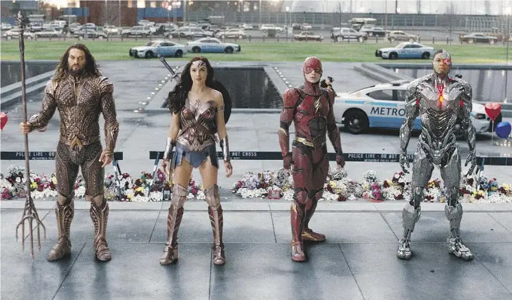  ?? WARNER BROS. ?? Jason Momoa, left, as Aquaman, Gal Gadot as Wonder Woman, Ezra Miller as The Flash and Ray Fisher as Cyborg prepare for a Justice League battle.