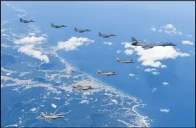  ?? AP PHOTO ?? U.S. Air Force B-1B bomber, F-35B stealth fighter jets and South Korean F-15K fighter jets fly over the Korean Peninsula during a joint drills, South Korea.