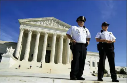  ?? MANUEL BALCE CENETA — THE ASSOCIATED PRESS ?? U.S. Supreme Court Police Department officers stand in front of the Supreme Court in Washington, Thursday.