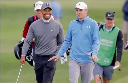  ?? AP ?? Tiger Woods (left) with Jordan Spieth as they approach the 17th green during the first round of the Valspar Championsh­ip. —