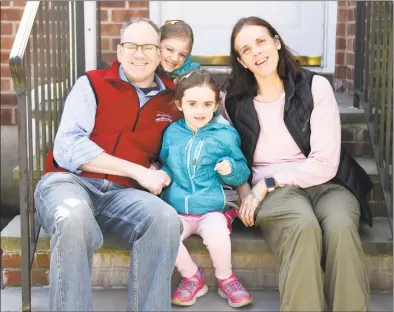  ?? Tyler Sizemore / Hearst Connecticu­t Media ?? Brian and Kim Raney with their children, Olivia, 7, and Evelyn, 5, at their home in the Pemberwick neighborho­od of Greenwich on April 16.