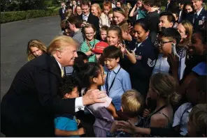  ?? AP/SUSAN WALSH ?? President Donald Trump meets with children Thursday as part of Take Our Daughters and Sons to Work Day at the White House. Earlier he tweeted about former aide Donald McGahn, writing that if he’d wanted Robert Mueller fired, “I didn’t need McGahn to do it.”