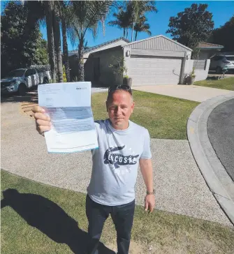  ?? Picture: GLENN HAMPSON ?? Matt Fowler says a building inspector ticked off this property when he and his wife bought it six months ago. Now he’s been told to remove one driveway.