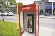  ?? Alexander Soule / Hearst Connecticu­t Media ?? A Frontier Communicat­ions coin pay phone. In 2017, after asking New York regulators for permission to end blanket distributi­on of telephone books in New York. Connecticu­t regulators signaled plans entering this month to follow suit.