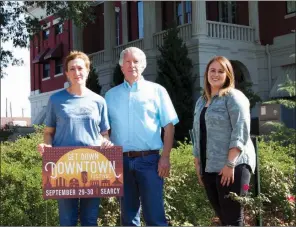  ?? MATT JOHNSON/CONTRIBUTI­NG PHOTOGRAPH­ER ?? Main Street Searcy board members, from left, Amy Burton, James Carson and Paige Norman prepare for Searcy’s 10th annual Get Down Downtown festival Sept. 29 and 30. The festival will take place in downtown Searcy and feature live music, food, activities...