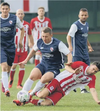  ??  ?? Shildon’s ex-Sunderland player David Ferguson makes his mark against Seaham Red Star (red and white stripes) in last week’s Northern League First Division draw. Pictures by Tim Richardson