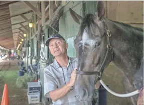  ?? ASBURY PARK PRESS FILE PHOTO ?? Trainer Jason Servis, seen in 2016 at Monmouth Park, hasn’t ruled out running Maximum Security in the Belmont Stakes on June 8.