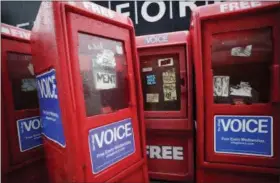  ?? AP FILE ?? Empty Village Voice newspaper boxes are shown on Nov. 27, 2013, on a sidewalk in Manhattan. The weekly publicatio­n stopped putting out a print edition last year and now will cease operations entirely.