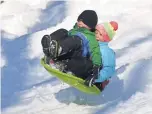  ?? FRANCOIS XAVIER MARIT, AFP/GETTY IMAGES ?? Children slide in the snow in Central Park in January 2016. A La Niña winter would mean colder than average temperatur­es in New York.