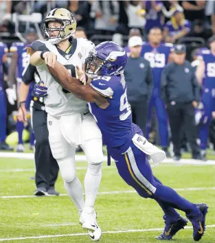  ?? BUTCH DILL/AP ?? Vikings defensive end Danielle Hunter forces a Drew Brees fumble in the second half of a wild-card playoff football game Jan. 5, 2020, in New Orleans.