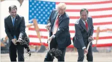  ?? EVAN VUCCI THE ASSOCIATED PRESS ?? Wisconsin Gov. Scott Walker, U.S. President Donald Trump and Foxconn Chairman Terry Gou break ground at the Foxconn facility in Mt. Pleasant, Wis., in June.