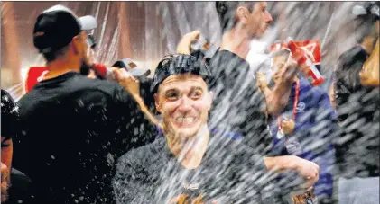  ?? AP PHOTO ?? After celebratin­g their NLDS series win over the Arizona Diamondbac­ks, Clay Bellinger and the Los Angeles Dodgers must get ready for the reigning World Series champion Chicago Cubs.