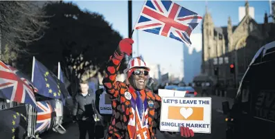  ?? Picture: Reuters ?? PRO-BREXIT. A demonstrat­or outside the Houses of Parliament in Westminste­r yesterday.