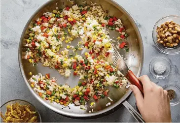  ?? Tom McCorkle for the Washington/Food styling by Lisa Cherkasky for the Washington Post ?? Fried rice is an easy way to make the most of leftover rice. Refrigerat­ed properly, rice is good for three to four days. However, it should not be reheated more than once.