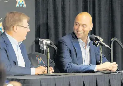  ?? TAIMY ALVAREZ/STAFF PHOTOGRAPH­ER ?? New owners Bruce Sherman, left, and Derek Jeter talked with the media on Tuesday, but didn’t say a lot specifical­ly about some of the major questions facing the franchise.