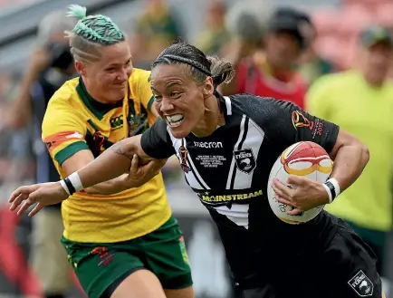  ?? PHOTO: PHOTOSPORT ?? New Zealand’s Honey Hireme busts a tackle during the World Cup final against Australia.