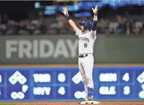  ?? GETTY IMAGES ?? The Brewers’ Ryan Braun celebrates his two-run double against the Giants during the sixth inning Friday night at Miller Park. Find game coverage at jsonline.com/brewers.