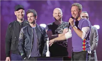  ??  ?? This file photo shows British musician Chris Martin and members of the band Coldplay on February 24, 2016. — AFP