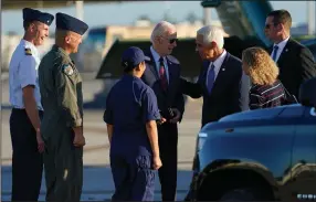  ?? (AP/Evan Vucci) ?? President Joe Biden talks with Florida Democratic gubernator­ial candidate Charlie Crist at the airport in Opa-locka, Fla., on Tuesday before a rally for Crist and Senate candidate Rep. Val Demings, D-Fla., at Florida Memorial University. U.S. Rep. Debbie Wasserman Schultz, D-Fla., is at right.