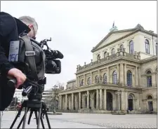  ?? JULIAN STRATENSCH­ULTE — DPA VIA AP ?? A TV cameraman films outside the State Opera in Hanover, Germany, Monday, Feb. 13, 2023.
