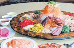  ??  ?? The auspicious seafood salad at Loong Foong Chinese restaurant, Swissotel le Concord.