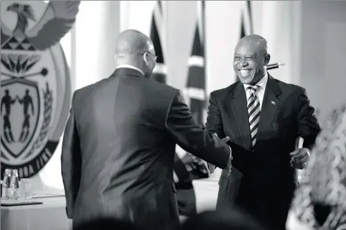  ?? PICTURE: JENNIFER BRUCE ?? THAT WAS THEN: President Jacob Zuma shakes Tokyo Sexwale’s hand soon after he was sworn in as minister of human settlement­s in 2009.