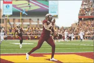  ?? The Associated Press ?? FINDING THE ENDZONE: Minnesota wide receiver Rashod Bateman (13) runs the ball in the end zone for a touchdown during an NCAA college football game against Penn State, Saturday, in Minneapoli­s.