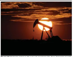  ?? (AP/Eric Gay) ?? The sun sets Wednesday behind an idle pump jack near Karnes City, Texas. Demand for oil continues to fall amid the coronaviru­s outbreak.