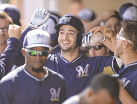  ?? JOE CAMPOREALE, USA TODAY SPORTS ?? “Nobody’s fans have ever cheered for the opposing team’s best player,” says Brewers outfielder Ryan Braun, center.